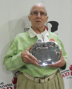 MIKE REUTHER/Sun-Gazette Judy VanSant, of Williamsport, holds the Hunger Hero Award she received Thursday for her 15 years of volunteer service to the Central Pennsylvania Food Bank.